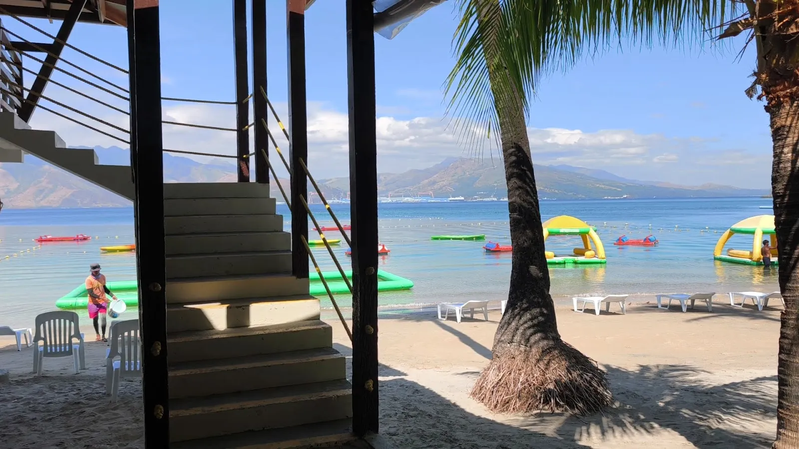 Beach view with water-sports floats offshore