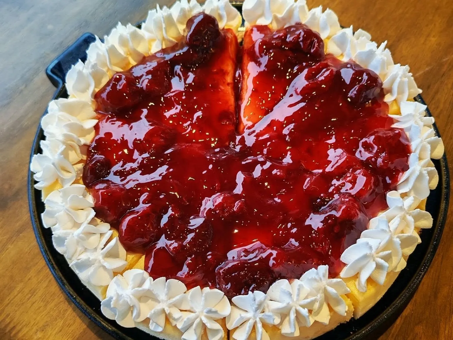 Whole strawberry-topped cheesecake