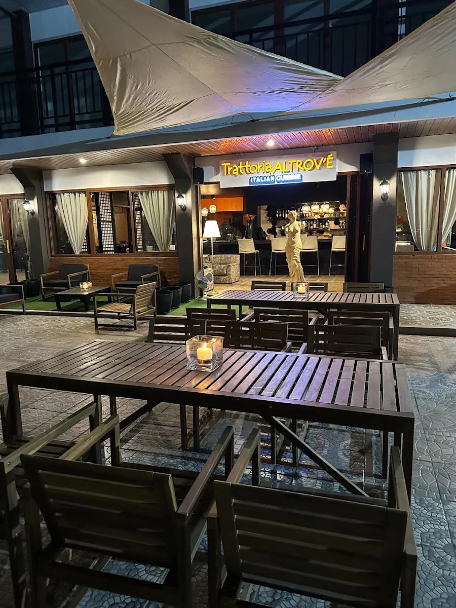 Outdoor terrace and storefront at night