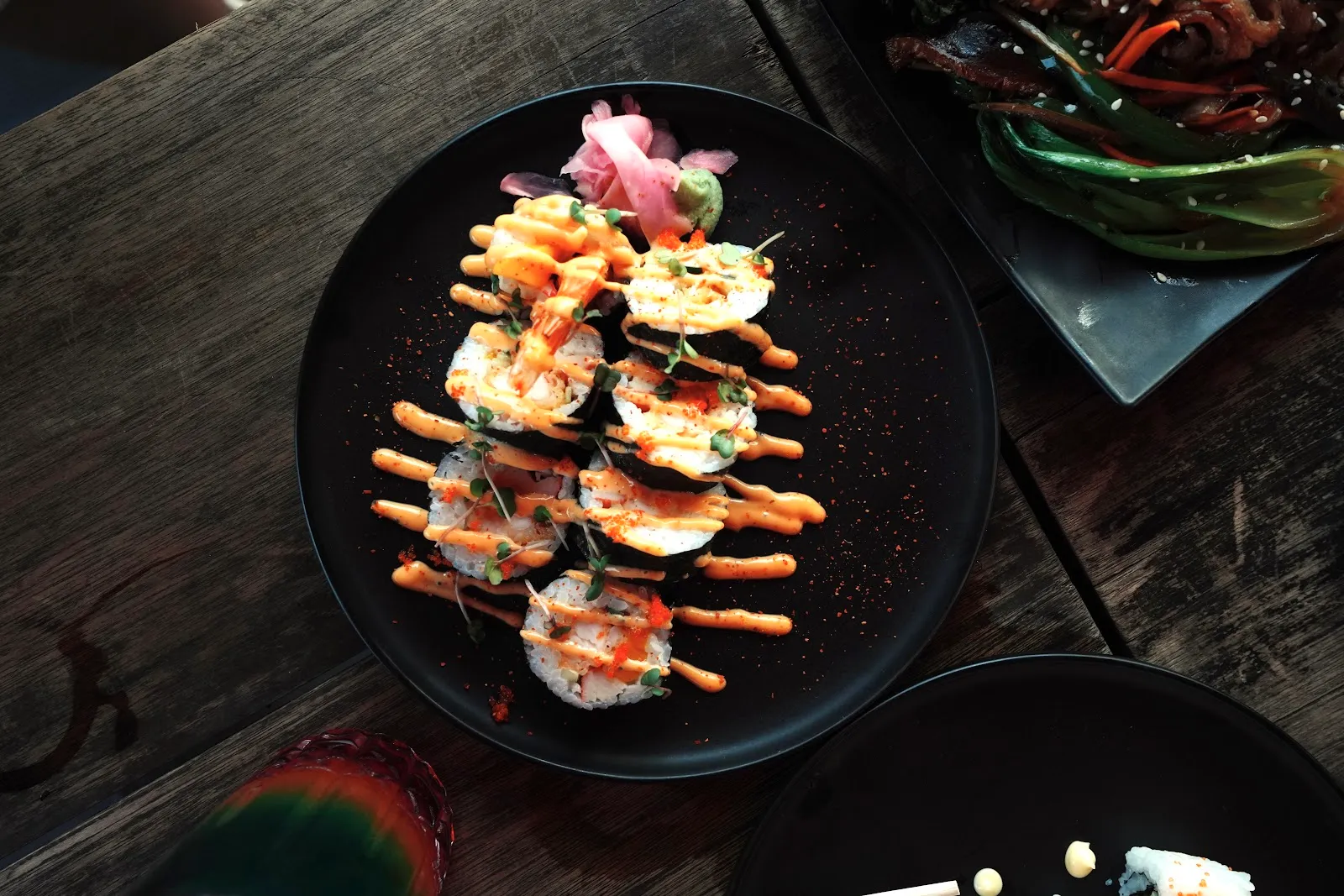 Skewers plated with sauce