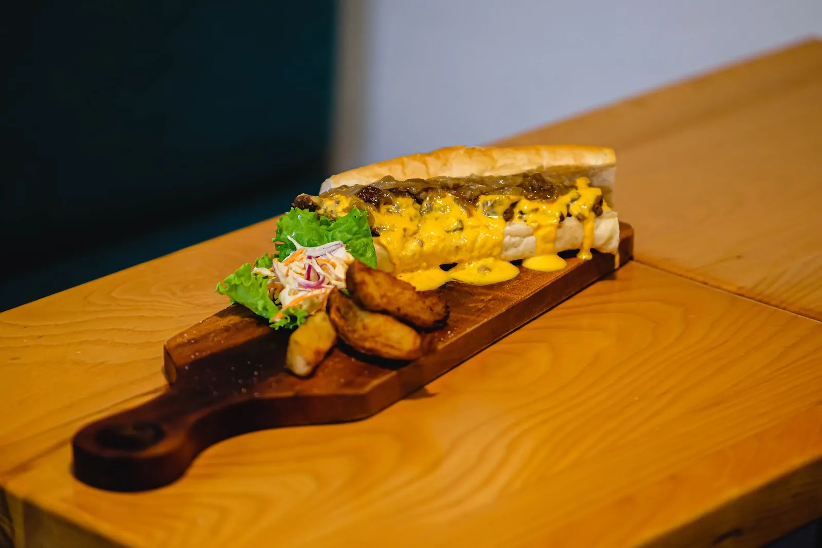 Sandwich with fries on a board