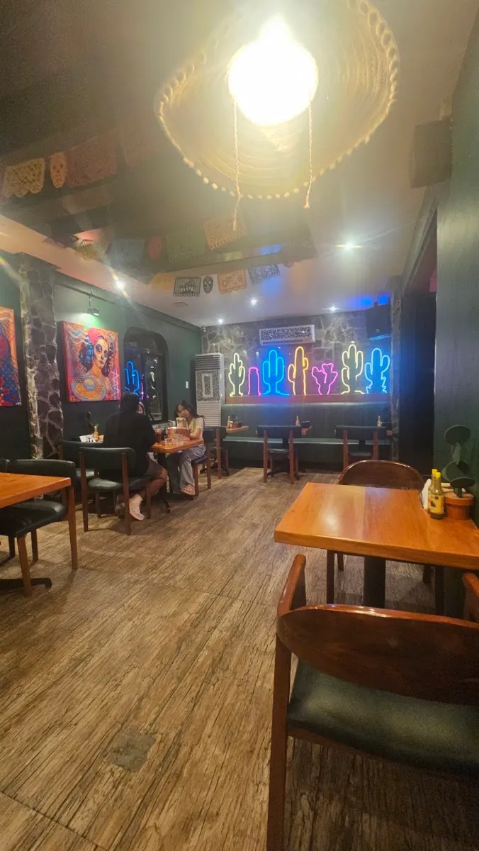 Interior seating under neon signs