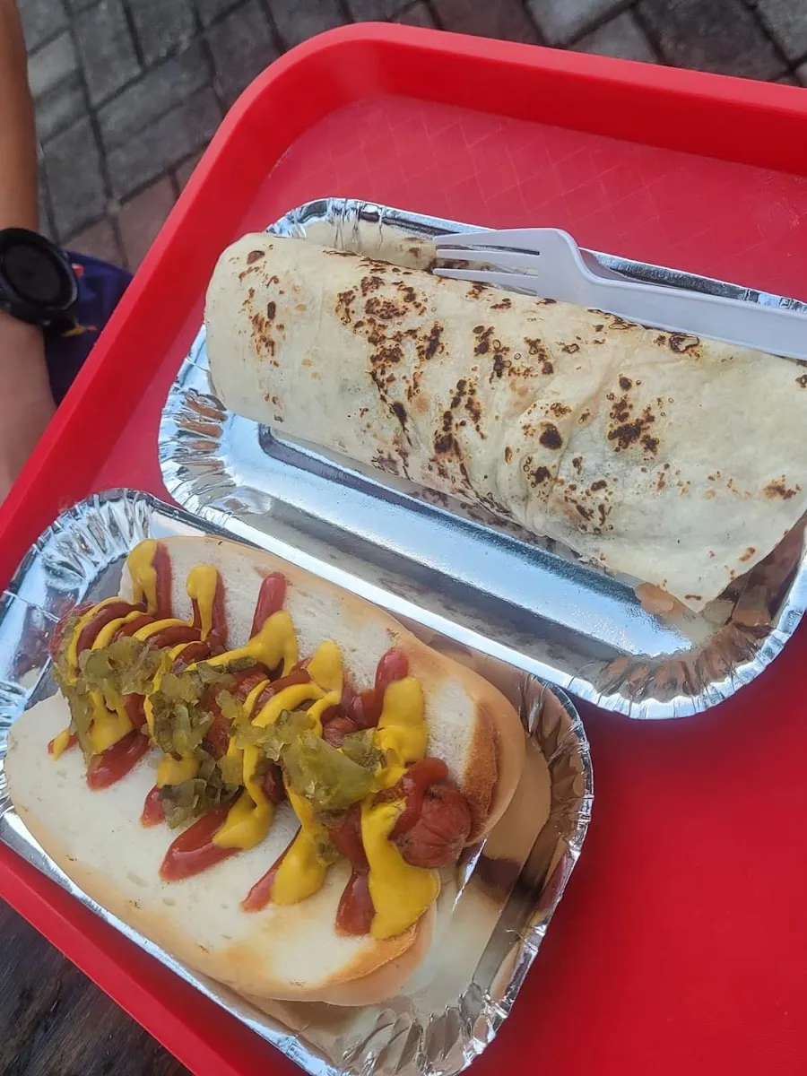 Burrito and chilli hotdog on a tray