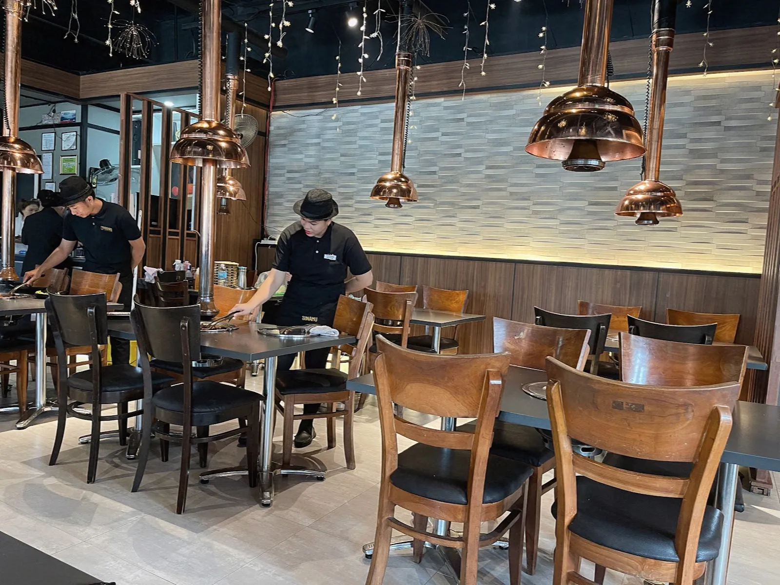 Grill tables with overhead vents