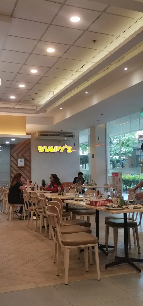 Dining area with Wimpy's signage