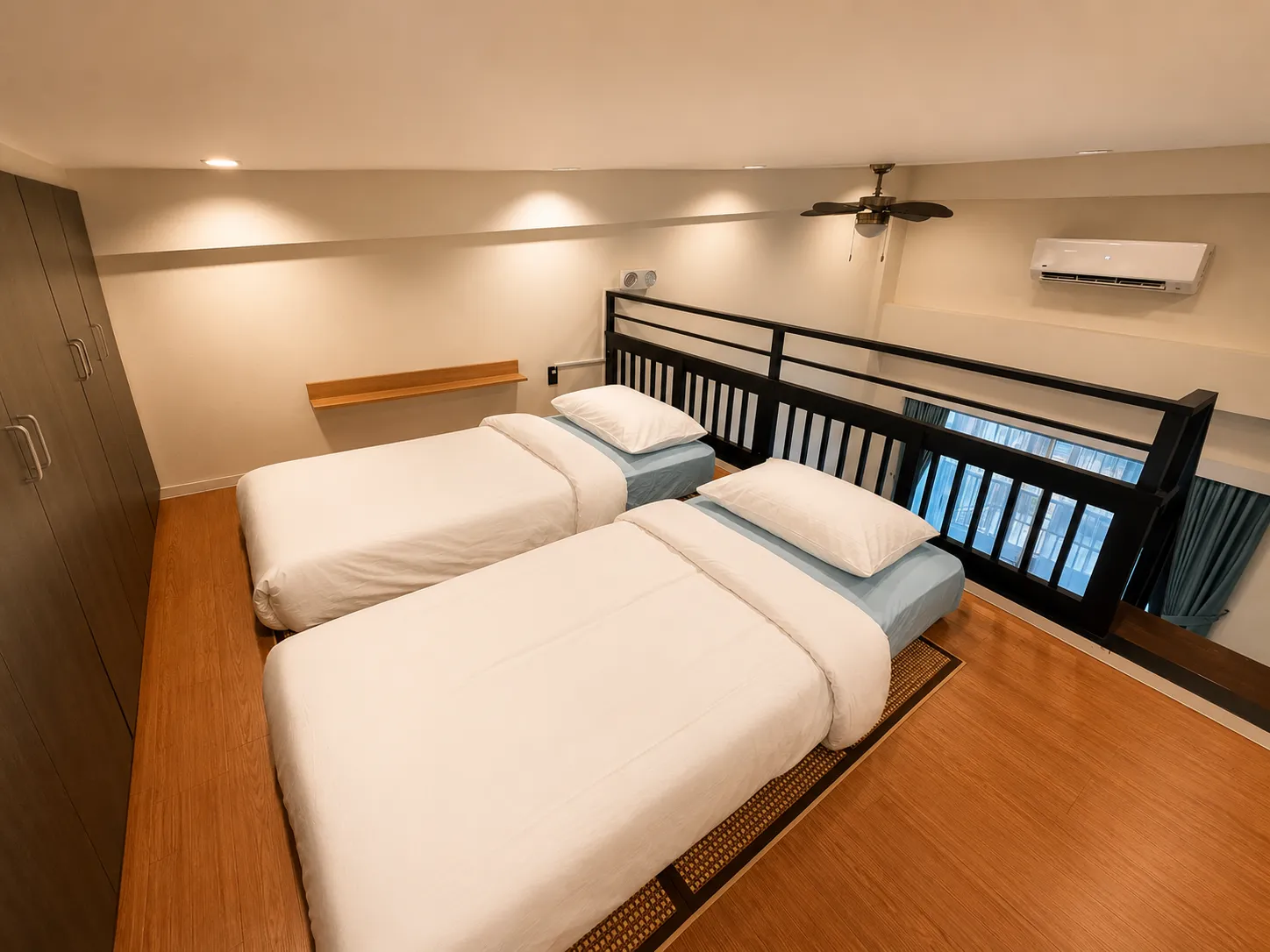 Room with twin beds and loft