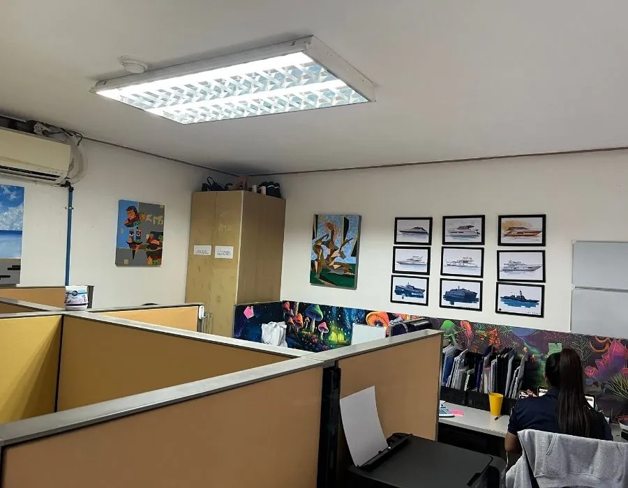 Office with yacht photos on the wall