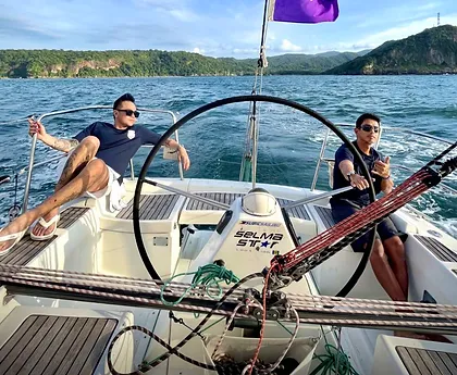 At the helm of a racing yacht