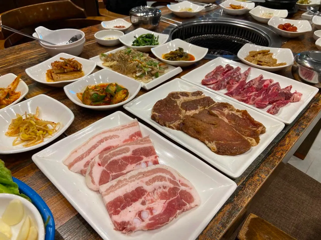 Meat and banchan set on the grill table
