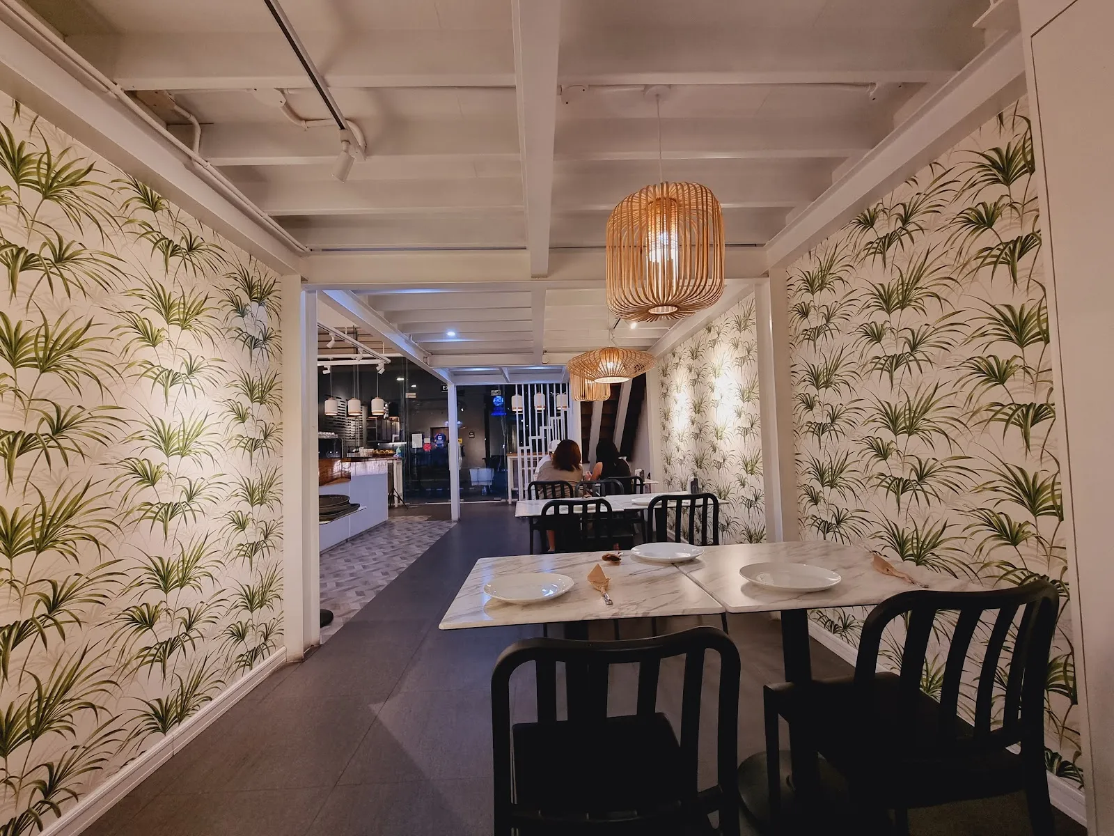 Dining area with botanical wallpaper