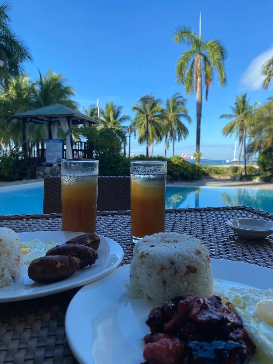 Poolside breakfast with palm trees